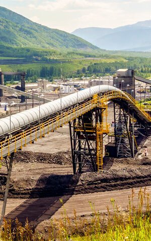 Big industrial infrastructure among mountains in Alberta, Canada